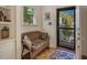 Cozy entryway featuring a bench, wooden floors, and a view of the outdoors, creating a warm welcome at 515 Swim & Croquet, Pittsboro, NC 27312
