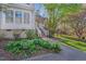 Quaint home featuring a landscaped yard, walkway, and inviting entrance at 515 Swim & Croquet, Pittsboro, NC 27312