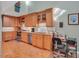 Well-lit kitchen featuring wood cabinets, granite counters, and stainless steel appliances at 515 Swim & Croquet, Pittsboro, NC 27312