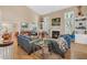 Bright living room features a fireplace, tall ceilings and hardwood floors, creating a cozy atmosphere at 515 Swim & Croquet, Pittsboro, NC 27312