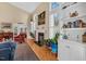 Bright living room with fireplace, built-in shelving, and elegant decor at 515 Swim & Croquet, Pittsboro, NC 27312
