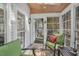 Screened porch features a ceiling fan, natural light and outdoor furniture at 515 Swim & Croquet, Pittsboro, NC 27312