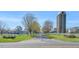 Scenic street view features mature trees, lush landscaping, and a silo in the background at 515 Swim & Croquet, Pittsboro, NC 27312