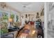 Charming sunroom with comfortable furniture, a ceiling fan, and natural lighting at 515 Swim & Croquet, Pittsboro, NC 27312