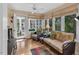Cozy sunroom featuring comfortable seating, large windows, and a tranquil view at 515 Swim & Croquet, Pittsboro, NC 27312