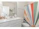 Bathroom with a single sink vanity, a toilet and a shower with a colorful curtain at 609 Rawls Dr, Raleigh, NC 27610
