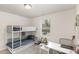 Comfortable bedroom featuring natural light and a modern desk space at 609 Rawls Dr, Raleigh, NC 27610