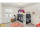 Charming bedroom with natural light, playful decor, and a colorful rug at 609 Rawls Dr, Raleigh, NC 27610