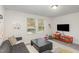 Cozy living room with neutral walls, plush carpet, and bright windows at 609 Rawls Dr, Raleigh, NC 27610