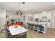 Open concept living area with a kitchen island, dining table and furniture in the living room at 609 Rawls Dr, Raleigh, NC 27610