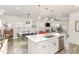 Open concept area with stainless steel appliances, a kitchen island, dining area, and living room at 609 Rawls Dr, Raleigh, NC 27610