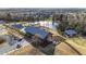 Overhead view of a community's pool, farmhouse, lake, walking trails, and surrounding neighborhood at 6205 Taylor Rd, Wendell, NC 27591