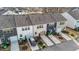 Aerial view of the back of townhomes featuring driveways, garages and landscaping at 6205 Taylor Rd, Wendell, NC 27591