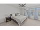 Cozy bedroom with plush carpet, natural light, and neutral decor with ceiling fan at 6205 Taylor Rd, Wendell, NC 27591