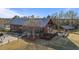 View of community's farmhouse featuring a pool, outdoor seating, and ample parking at 6205 Taylor Rd, Wendell, NC 27591