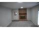 Cozy basement featuring brick fireplace and neutral carpet at 6600 Coach Light Cir, Raleigh, NC 27613