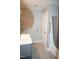 Bright bathroom featuring a modern sink and shower with glass door at 6600 Coach Light Cir, Raleigh, NC 27613