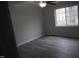 Bedroom featuring sleek flooring, a ceiling fan, and a bright window for natural light at 6600 Coach Light Cir, Raleigh, NC 27613