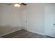 Bedroom with two doors, ceiling fan, and light-colored walls provides a blank canvas at 6600 Coach Light Cir, Raleigh, NC 27613