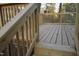 Deck with wooden railing featuring natural wood floors in an outdoor setting at 6600 Coach Light Cir, Raleigh, NC 27613