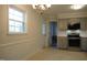 Eat-in kitchen featuring stainless steel appliances and natural lighting at 6600 Coach Light Cir, Raleigh, NC 27613