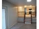 Open living room featuring stairs leading up to the kitchen at 6600 Coach Light Cir, Raleigh, NC 27613
