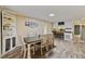 Open concept living space with dining area and view into kitchen at 7155 Old Fairground Rd, Benson, NC 27504