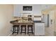 Open kitchen with breakfast bar seating for casual dining at 7155 Old Fairground Rd, Benson, NC 27504