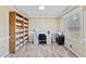 Inviting home office with custom shelving, natural light, and ample storage at 7155 Old Fairground Rd, Benson, NC 27504