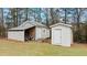 This property features two detached storage buildings, offering ample space for tools and equipment at 7155 Old Fairground Rd, Benson, NC 27504