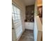 Wet bar features a wine rack, built in shelves and door leading outside at 829 S Franklin St, Wake Forest, NC 27587