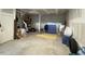 Unfinished basement with concrete walls, fitness area, and storage at 829 S Franklin St, Wake Forest, NC 27587