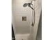 Modern shower with multiple shower heads, tiled walls, and recessed shampoo niche at 829 S Franklin St, Wake Forest, NC 27587