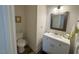Bathroom with a toilet, vanity with sink, and modern decor touches at 829 S Franklin St, Wake Forest, NC 27587