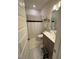 Compact bathroom featuring a shower, toilet, vanity, and storage at 829 S Franklin St, Wake Forest, NC 27587