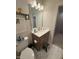 Bathroom vanity featuring a well-lit mirror and a step stool for children at 829 S Franklin St, Wake Forest, NC 27587