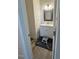 Cozy bathroom featuring a vanity with sink, a mirror, and neutral decor at 829 S Franklin St, Wake Forest, NC 27587
