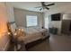 Bedroom with a ceiling fan, modern decor, and a television for entertainment at 829 S Franklin St, Wake Forest, NC 27587