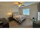 Spacious bedroom with elegant ceiling fan, and large windows for natural light at 829 S Franklin St, Wake Forest, NC 27587