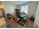 Dining room features stainless steel appliances and a large table set up for 6 at 829 S Franklin St, Wake Forest, NC 27587