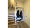 Functional entryway with storage cubbies, coat hooks, and a staircase at 829 S Franklin St, Wake Forest, NC 27587