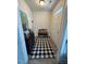 Inviting entryway with a stylish rug, a bench with decorative pillows, and tasteful wall art at 829 S Franklin St, Wake Forest, NC 27587
