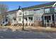 Street view of attractive townhomes, showcasing brick and siding exteriors at 829 S Franklin St, Wake Forest, NC 27587