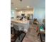 Modern kitchen with stainless steel appliances, granite countertops and breakfast bar seating at 829 S Franklin St, Wake Forest, NC 27587