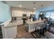 Modern kitchen features stainless steel appliances, granite countertops and white cabinets at 829 S Franklin St, Wake Forest, NC 27587