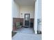 Inviting porch with seating area, brick accents, and stylish decor elements at 829 S Franklin St, Wake Forest, NC 27587