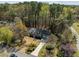 Aerial view of a house with a driveway and meticulous landscaping showcases its curb appeal and established neighborhood at 8429 Bells Lake Rd, Apex, NC 27539