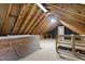 Large unfinished attic with wood beams and flooring, ready for customization at 8429 Bells Lake Rd, Apex, NC 27539