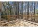 Spacious back deck overlooking a lush, wooded backyard, perfect for outdoor relaxation at 8429 Bells Lake Rd, Apex, NC 27539