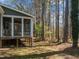 Secluded screened-in porch overlooking a peaceful, wooded backyard at 8429 Bells Lake Rd, Apex, NC 27539